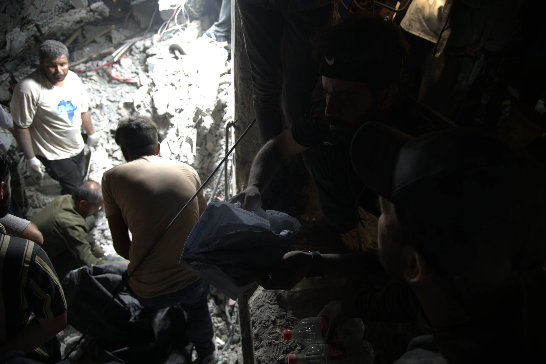 Rescue workers searching the collapsed structure