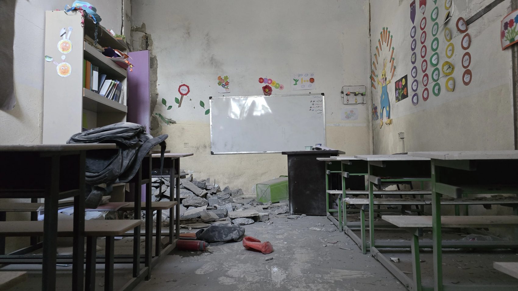 A classroom with whiteboard and desks