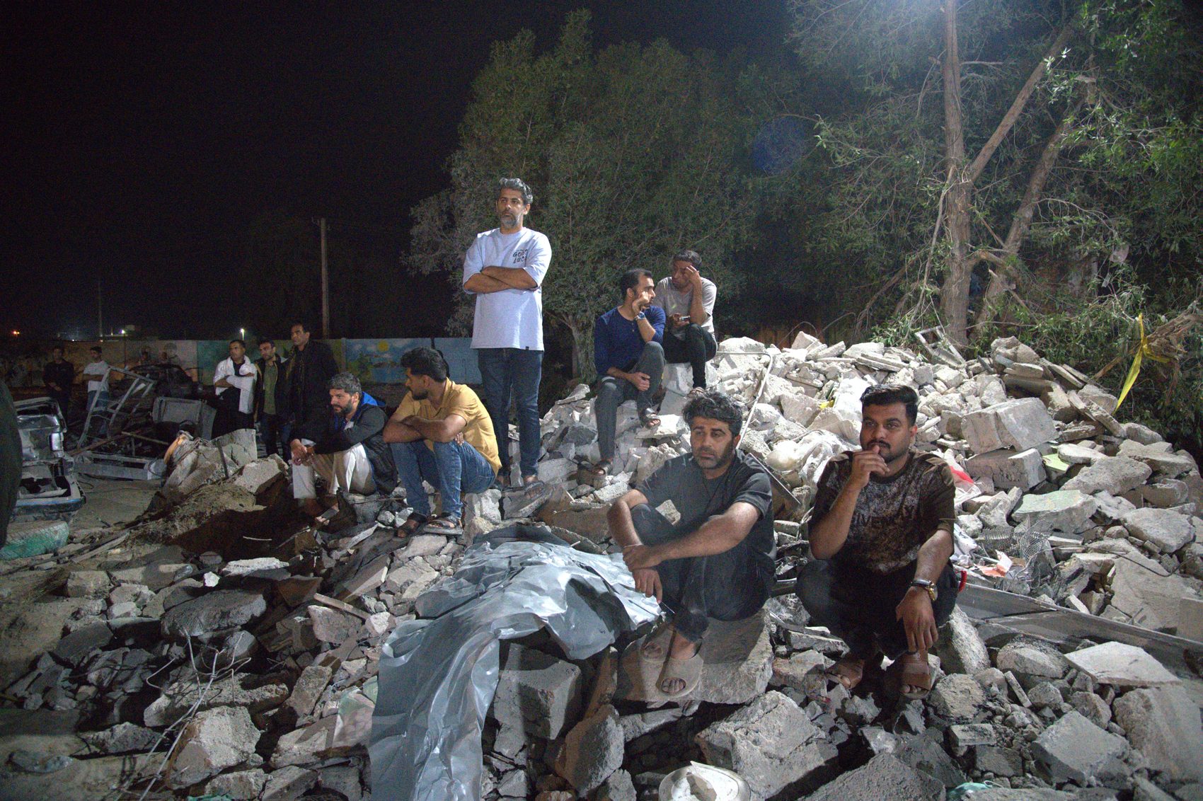 Rescue teams searching the rubble at night